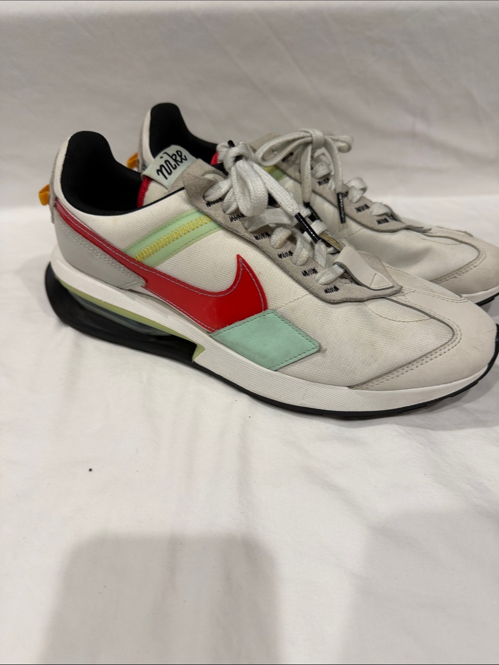 Nike Men’s White Sneakers with Red Swoosh and Mint Accents